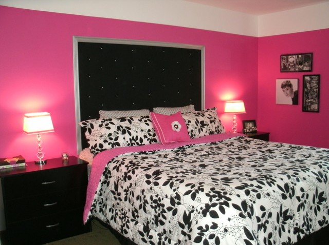 pink bedroom with black furniture